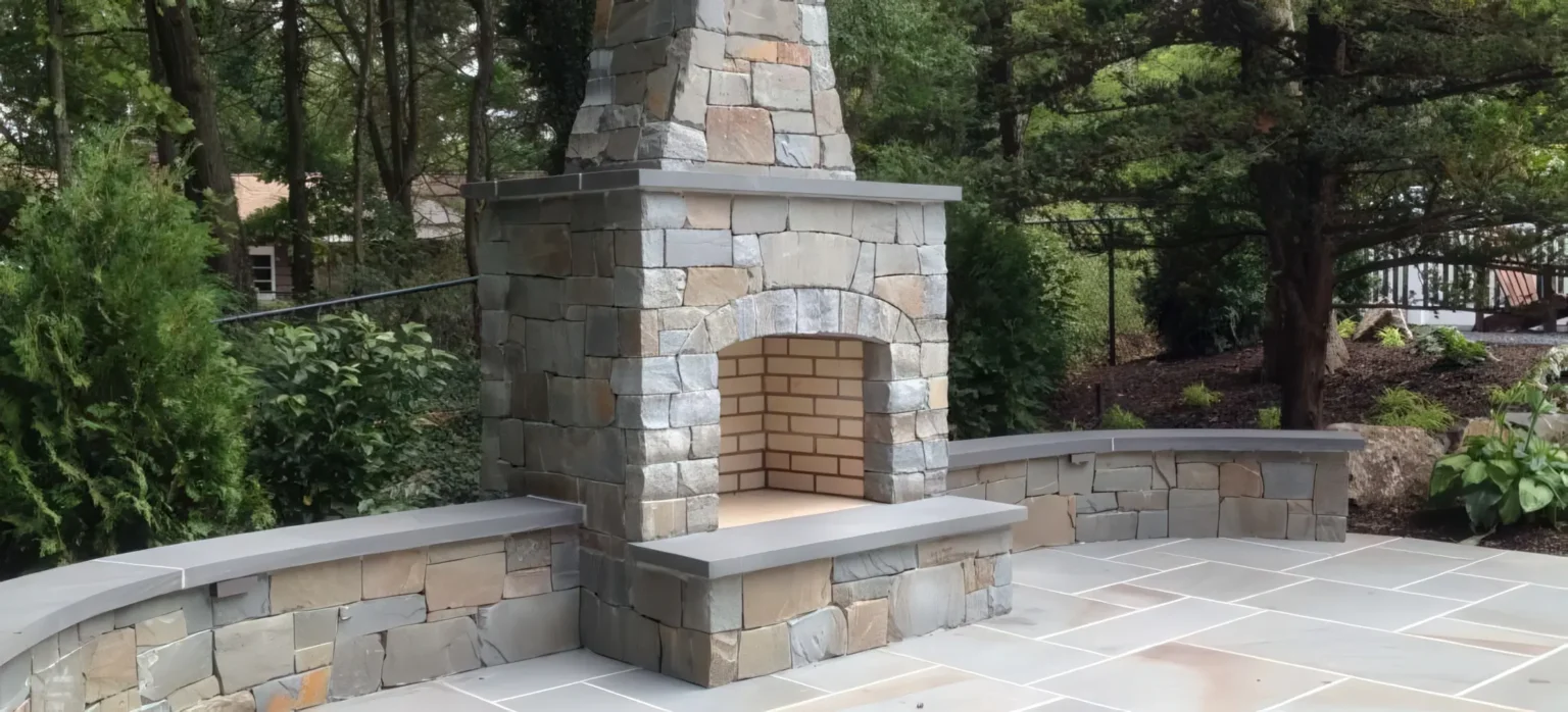 Tall natural stone outdoor fireplace