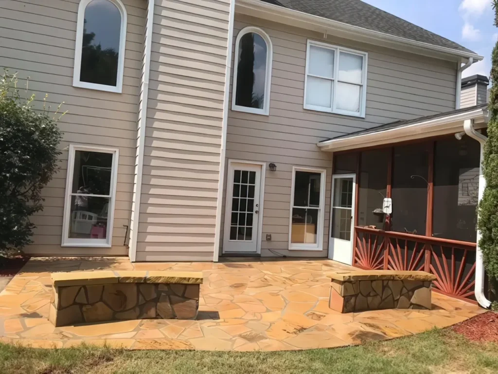 After: new flagstone patio with two built-in stone seat walls